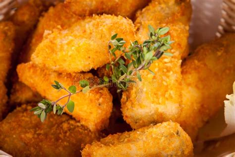 Crumbed Chicken Nuggets in a Basket Stock Photo - Image of golden ...