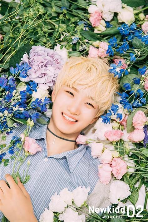 Rookie boy group Newkidd with UNB's Hansol lie in a bed of flowers for ...