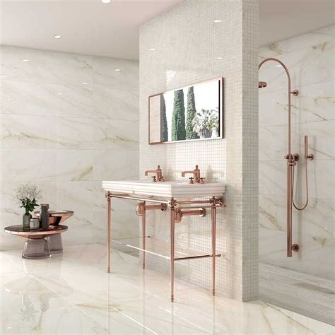 Trapani Gold marble effect porcelain tiles.A superb and very subtle marble effect tile having a ...