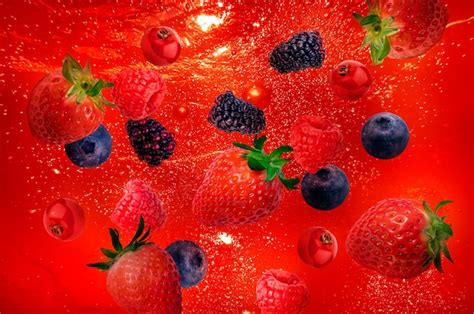 Premium Photo | A red background with fruits and berries on it