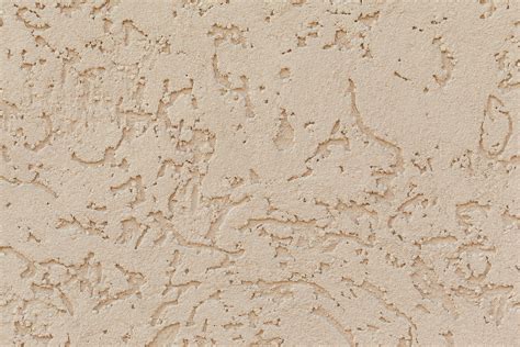 Beige colored stucco surface of wall · Free Stock Photo