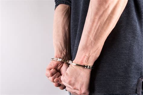 Hands In Handcuffs Free Stock Photo - Public Domain Pictures