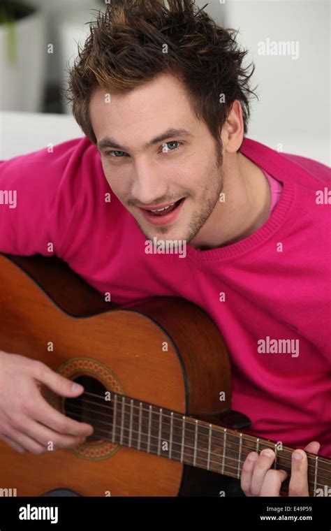 Man with acoustic guitar Stock Photo - Alamy