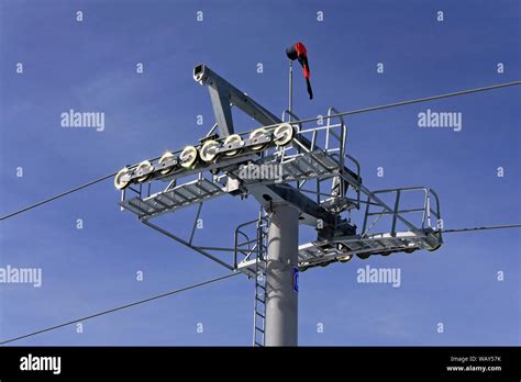 Pole and gears for cable chair ski lift Stock Photo - Alamy