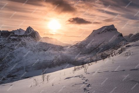 Premium Photo | Landscape of sunrise on snowy mountain at peak of segla