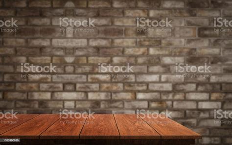 Wood Table In Front Of Brick Wall Blur Background Stock Photo - Download Image Now ...