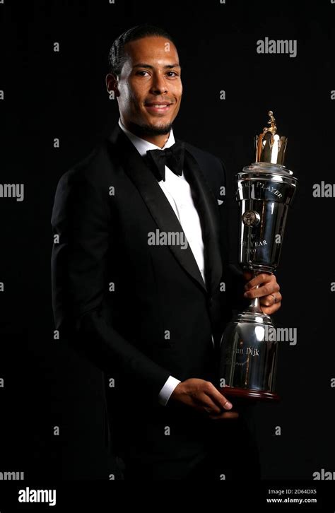 Liverpool's Virgil van Dijk poses with his PFA Player of the Year award ...