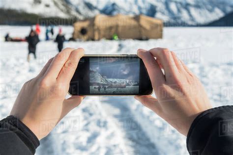 Man photographing people ice diving, Banff, Alberta, Canada - Stock ...