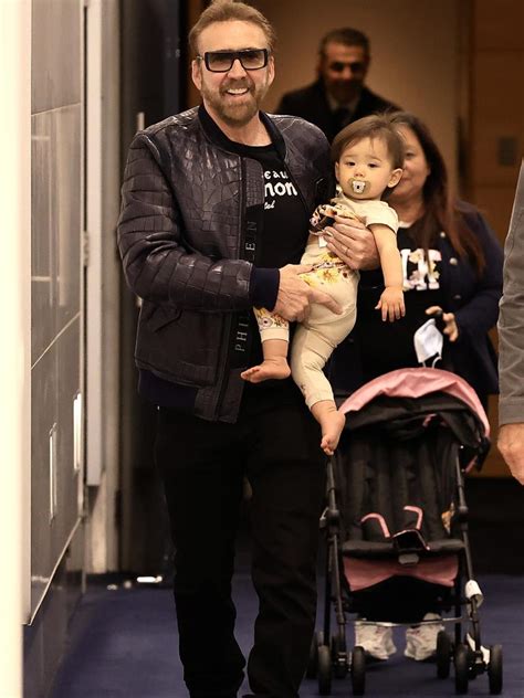 Nicolas Cage arrives at Sydney Airport with baby daughter and wife ...