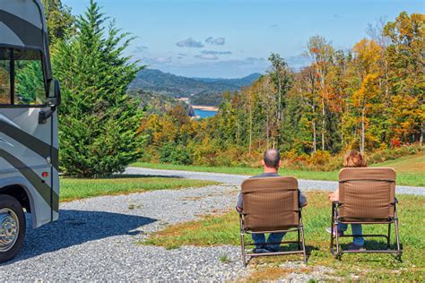 Couple Enjoying The View From Their Rv Campsite Stock Photo - Download ...