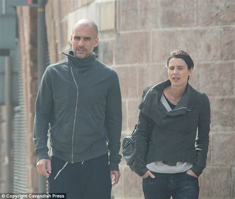 Pep Guardiola strolls through Manchester with his wife | Daily Mail Online