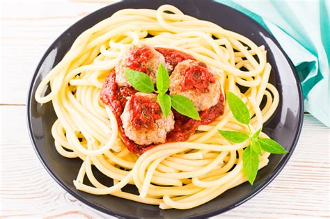 Closeup Of Spaghetti And Meatballs In Tomato Sauce With Fresh Basil Leaves Stock Photo ...