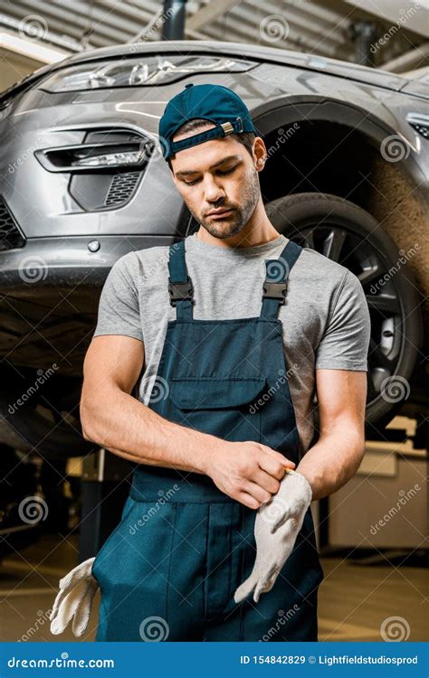 Portrait of Auto Mechanic in Uniform Wearing Protective Gloves Stock Image - Image of uniform ...