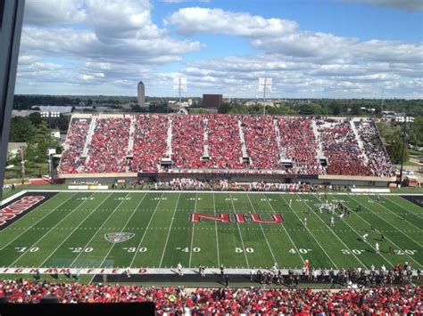 a football stadium filled with lots of red and white fans watching the ...