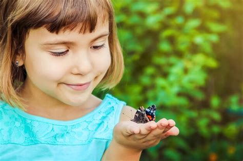 Premium Photo | Close-up of girl holding insect