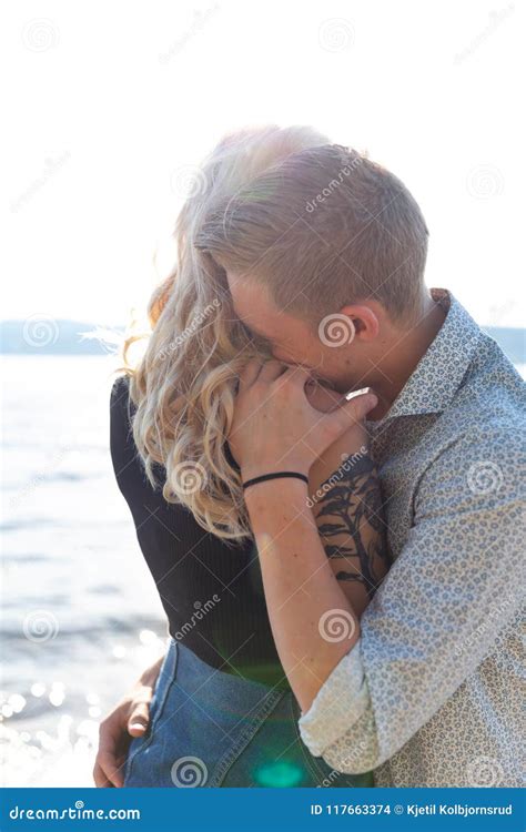 Couple in Romantic Embrace on Beach in Summer Stock Photo - Image of daylight, flares: 117663374