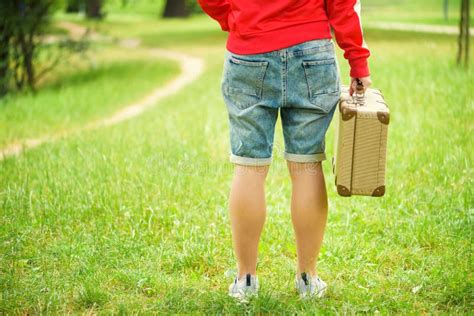 Young Person is Standing with an Vintage Suitcase. Photo from the Back. Local Travel Concept ...