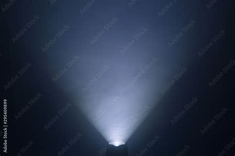 flashlight and light beam in dark mist room at night . abstract ...