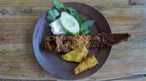 Premium Photo | Savor pecel lele or pecak lele east java's delight deep fried catfish with ...