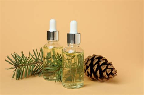 Premium Photo | Aromatherapy concept with pine oil on beige