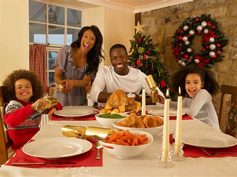 Black Family Christmas Dinner Stock Photos, Pictures & Royalty-Free Images - iStock