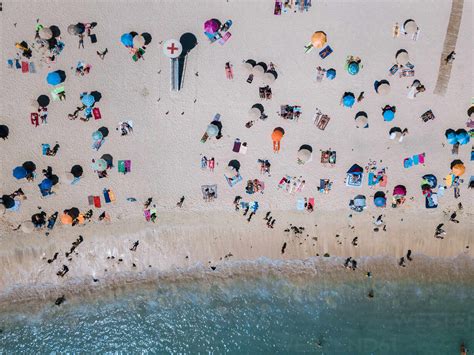 Drone View Of People At Beach stock photo