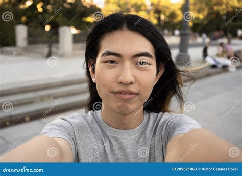 Selfie Shot of Young Handsome Chinese Tourist Male with Confident Expression while Visiting ...