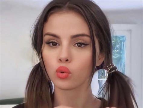 Selena Gomez poses with red round lips, any thoughts? | Scrolller