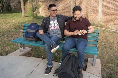 Premium Photo | Couple sitting on bench