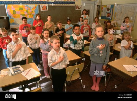 Children in classroom saying the Pledge of Allegiance Stock Photo: 722388 - Alamy