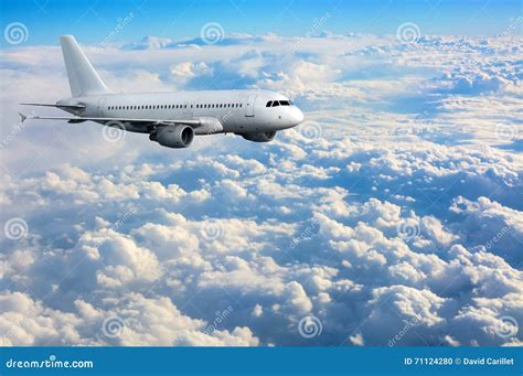 Commercial Passenger Plane Flying Above Clouds Stock Photo - Image of transport, fuselage: 71124280