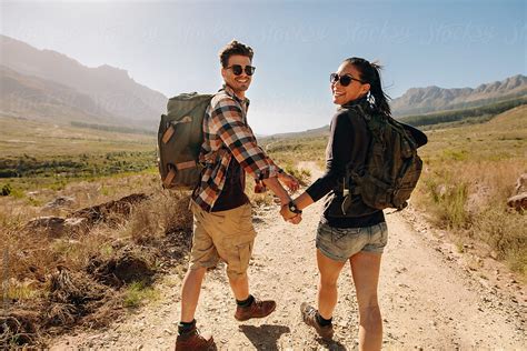 "Beautiful Young Couple On Hiking Trail In Nature Reserve" by Stocksy ...