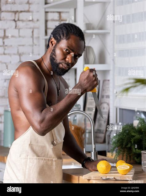 Black man cooking breakfast or lunch on kitchen at home. African ...