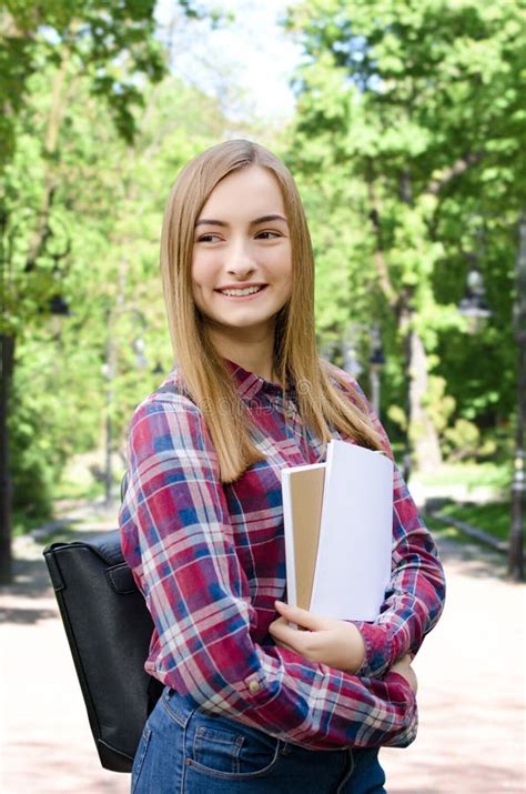 Young Girl Outdoor Holding Books Stock Image - Image of high, female ...