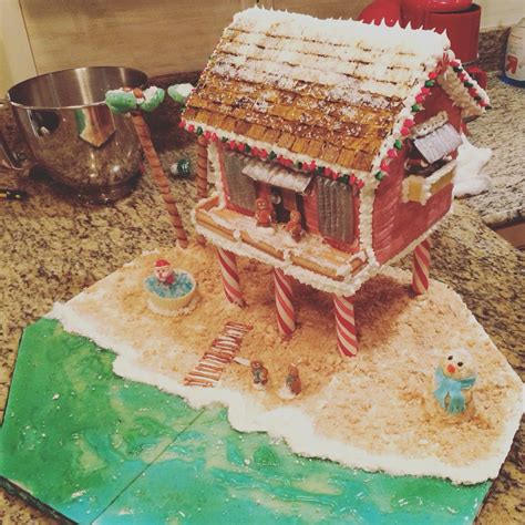 Beach House Gingerbread House with Santa in a Hot Tub