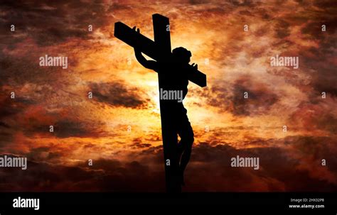 Jesus Christ crucified on the cross at Calvary hill with burning sky in background Stock Photo ...