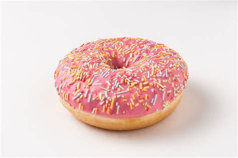 Donut with pink icing and sprinkles – License Images – 13192606 StockFood