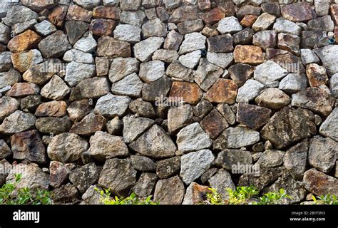 Natural stone masonry wall texture or background Stock Photo - Alamy