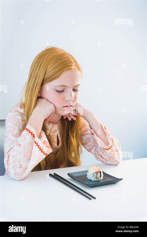 Girl at the dining table Stock Photo - Alamy