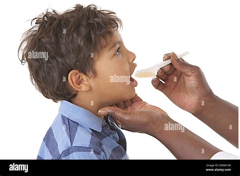 Syrup treatment child Stock Photo - Alamy