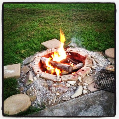 I made my own fire pit. Just dig a hole, fill with gravel, place bricks ...