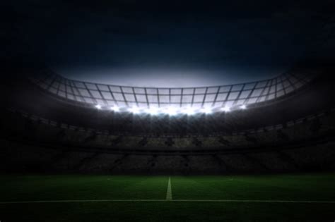 Premium Photo | Large football stadium under night sky