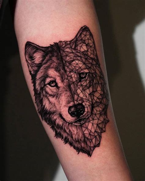 Wolf head tattoo located on the inner forearm.