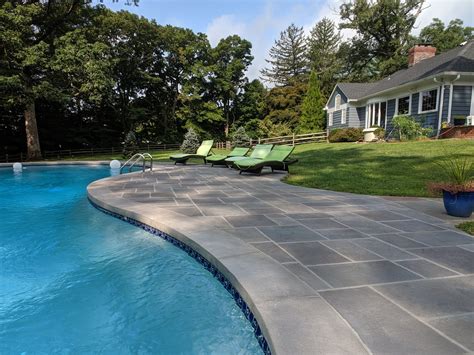 Unique Concrete - Stamped concrete pool deck around...