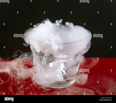 DRY ICE SOLIDIFIED CARBON DIOXIDE IN WATER SHOWS A SOLID PASSING INTO A GAS DIRECTLY SUBLIMATION ...