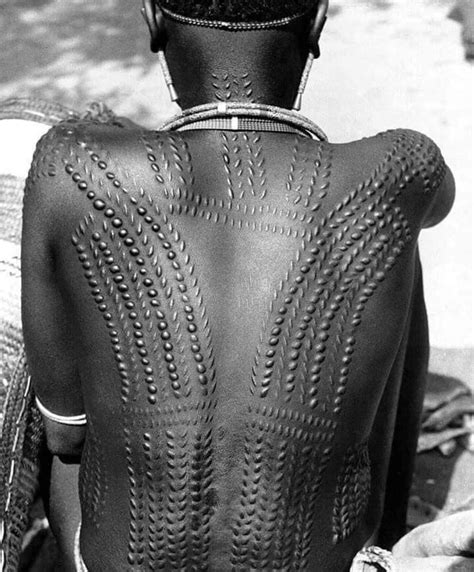 The pattern of Nuer scarification varies within specific subgroups. The ...