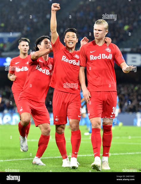 Erling Braut Haland of FC Salzburg (R) celebrates with Her Chan Hwang (C) and Takumi Minamino of ...