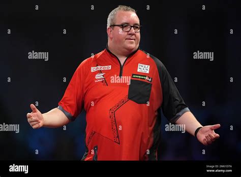 Stephen Bunting in action against Michael Smith during day fourteen of the Cazoo World Darts ...