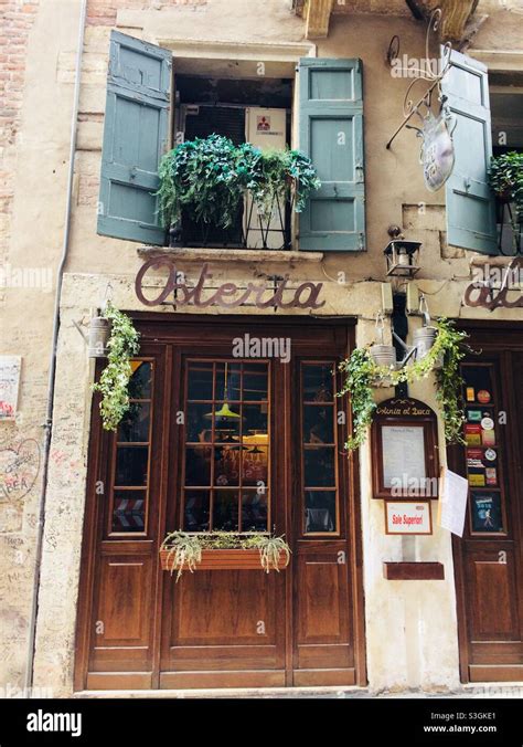 A quaint little osteria restaurant tucked into the beautiful city of Verona, Italy Stock Photo ...