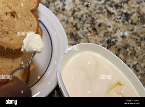 Person buttering toast hi-res stock photography and images - Alamy